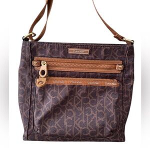 Calvin Klein Crossbody Bag|Brown signature logo print|Gold-tone hardware.